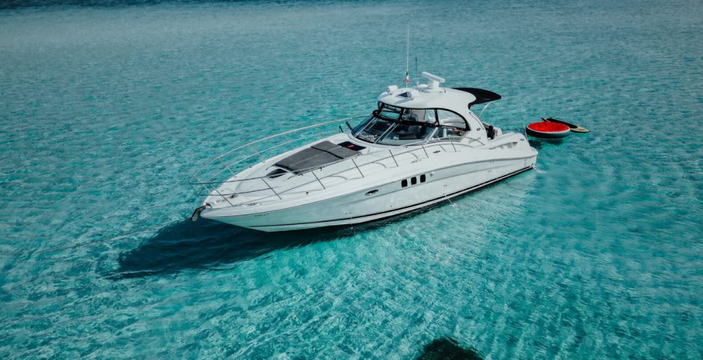 Sea Ray 40 over turquoise reef water