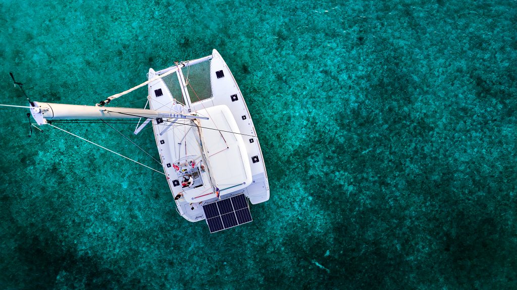 Aerial view of a sailing catamaran in Cozumel