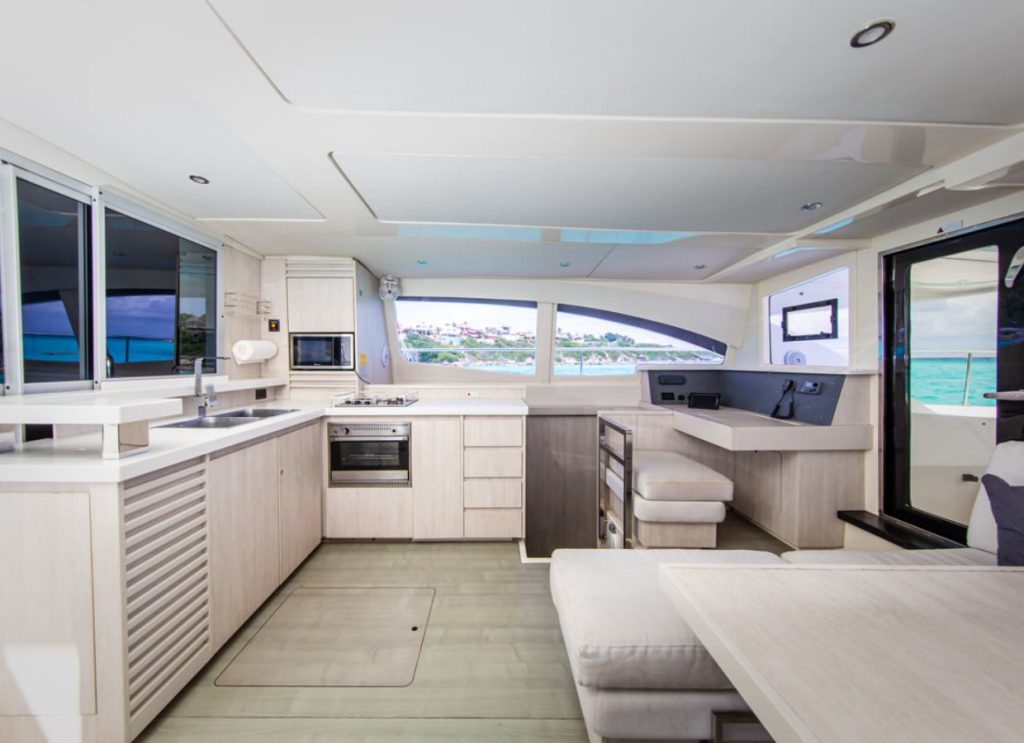 Bright catamaran salon and kitchen