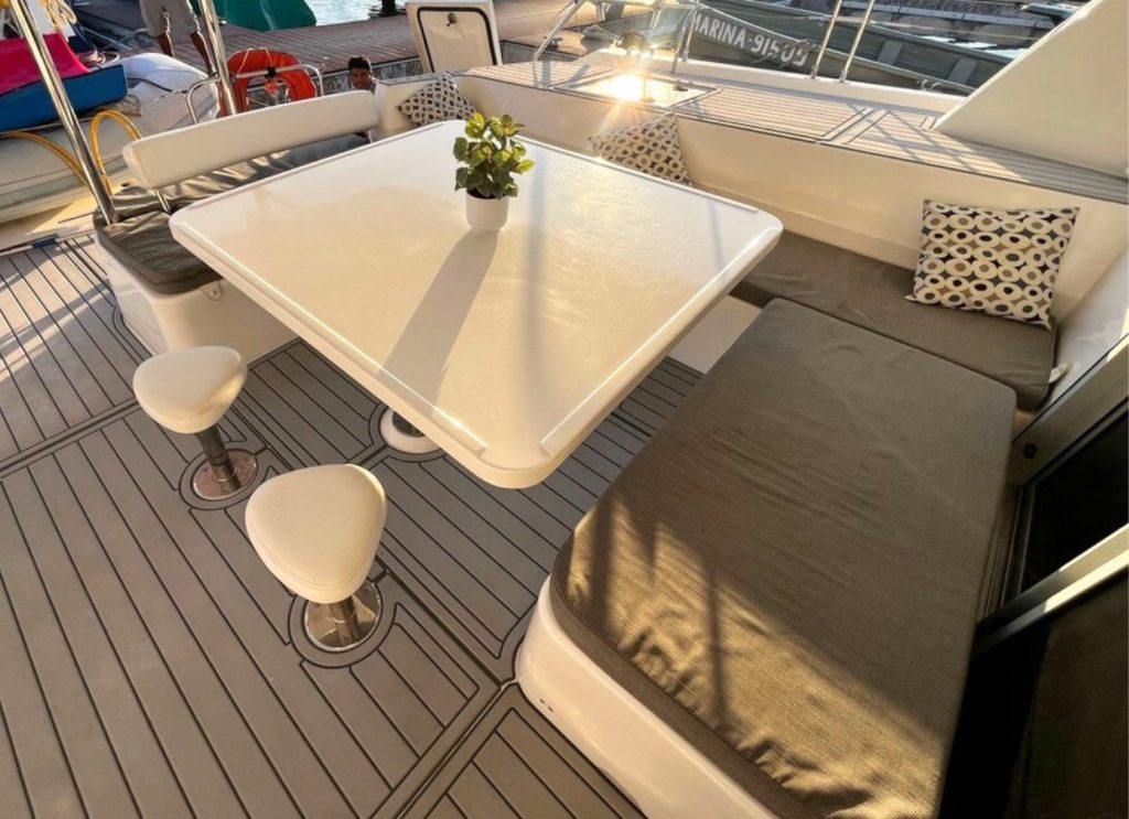 Shaded dining table on a catamaran deck