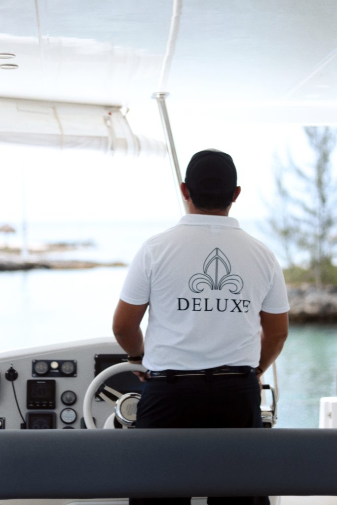 Captain at the helm in a Deluxe shirt
