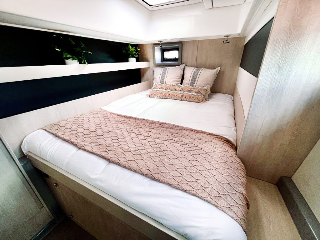 Comfortable catamaran cabin with a double bed