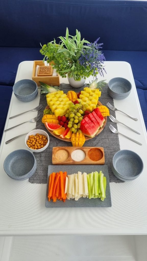 Tropical fruit and veggie platter on board