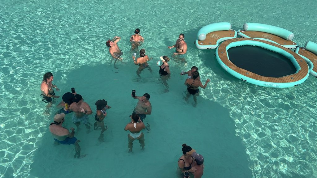 Guests playing in the shallow turquoise water