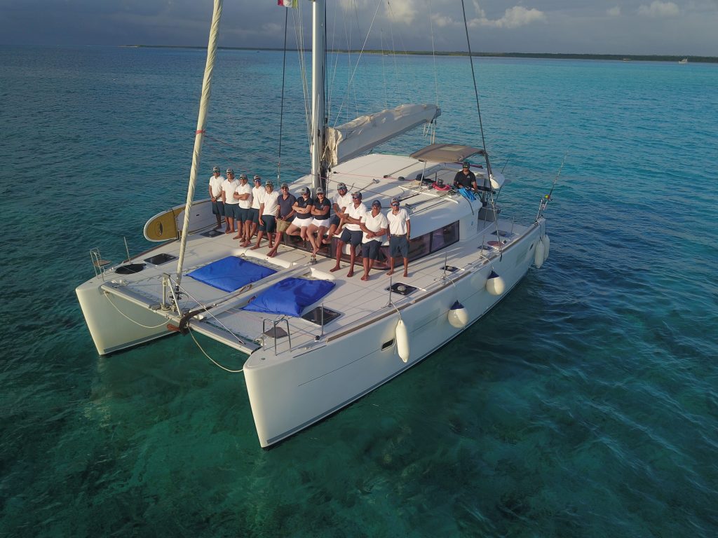 Aerial view of a catamaran with guests on board
