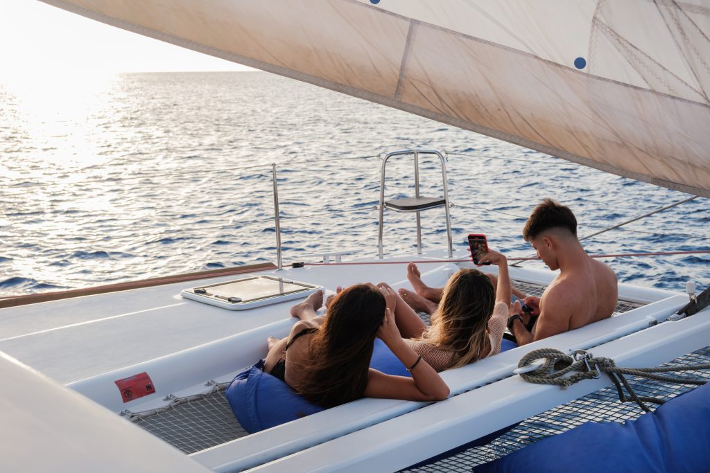 Friends relaxing on the catamaran nets