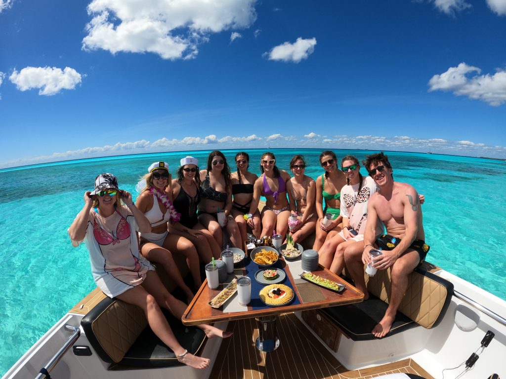 Group celebration around the table on the bow