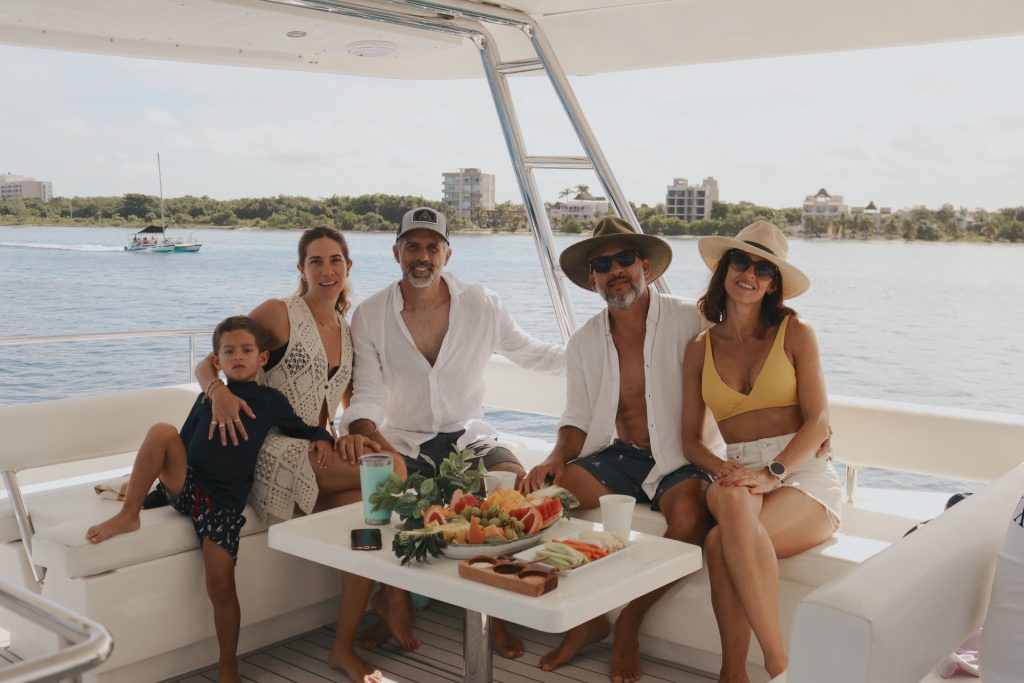 Family enjoying a lunch spread on deck