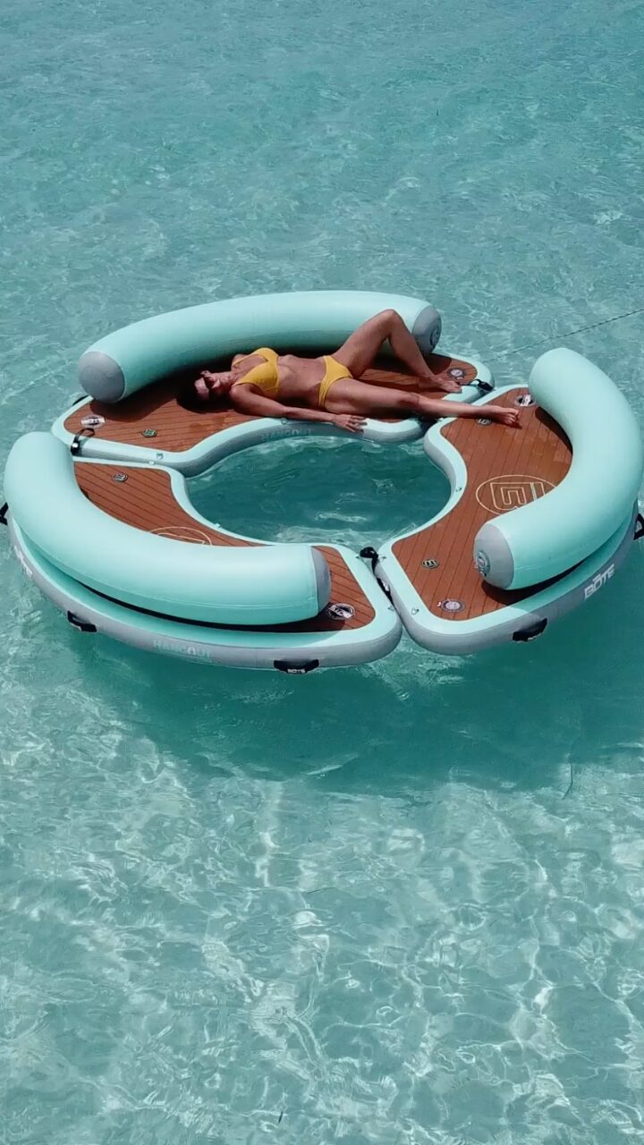 Guest relaxing on a floating platform at El Cielo