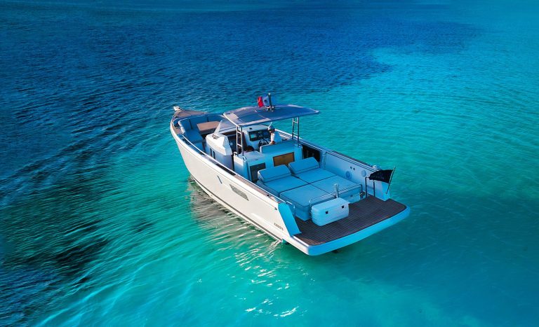 Aerial view of the Fjord 36 anchored over white sand, Cozumel
