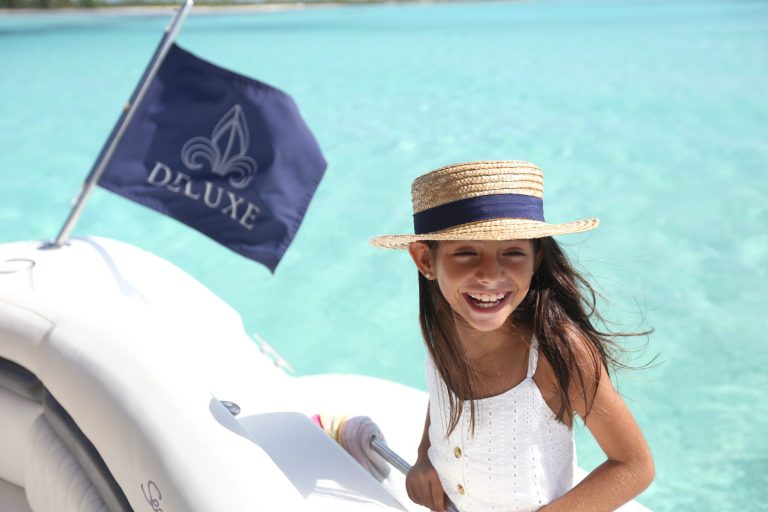 Family relaxing on the bow of the Sea Ray 40 Mint