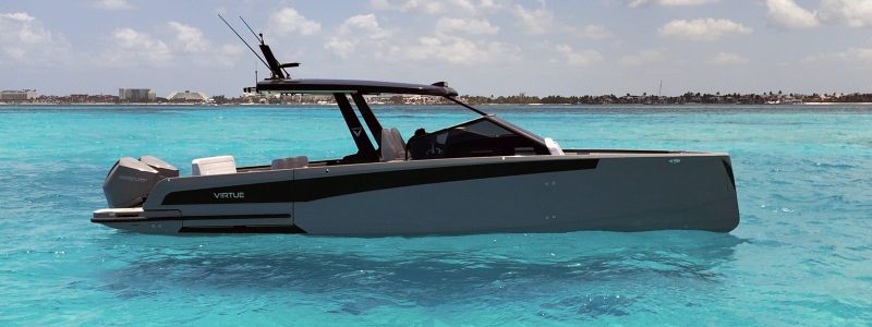Virtue 32 private boat charter in Cozumel, side view in turquoise water Virtue 32 private boat charter in Cozumel, side view in turquoise water