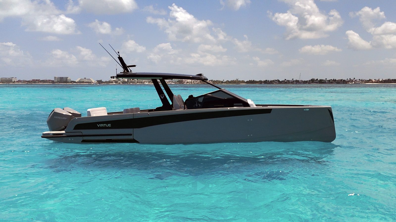 Virtue 32 private boat charter in Cozumel, side view in turquoise water