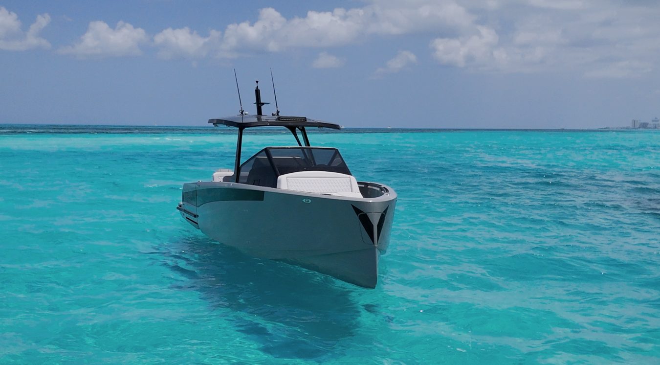 Virtue 32 bow view anchored in Cozumel turquoise water
